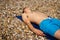 Sunbathing on a stoney beach