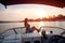 Sunbathing on a sunset, on front deck of a boat
