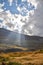 Sunbeam through the clouds in the Ordessa valley, Pyrenee mountains, Spain