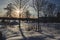 Sunbeam throgh tree and shadow on the snow with a nice snowscape