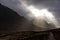 Sunbeams breaking through clouds in Glencoe Mountain