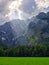 Sunbeams casting over mountains and meadow