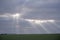 Sunbeams shining through gaps in the clouds at the end of a cold day in England