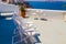 Sunbeds on terrace on Santorini island, Greece. Beautiful view on the sea