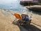 Sunbeds and umbrella on rocky beach in Corfu Island, Greece