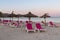 Sunbeds with umbrellas at the Playa de Alcudia beach in Mallorca, Spain