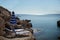 Sunbeds and umbrellas on rocky seashore