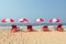 Sunbeds under tent on beach.