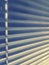 Sunblinds Silver aluminum louver on window horizontal pattern. Shutters On glass In The Office or home  interior