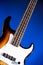 Sunburst Bass Guitar Isolated On Blue