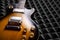 Sunburst electric guitar lying on acoustic foam panel background