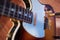 Sunburst vintage electric guitar gold hardware on wooden table in the room. business and music concept. Wallpaper or background