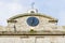 Sundial on an old building facade