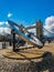 The sundial at St. Katharine docks and Tower Bridge over the River Thames in London, UK on a sunny day.