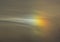 Sundog Rainbow Spot in Cloudy Sky