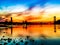 Sundown  at the beach of  the riverside of the river Rhein in Cologne with sunlight  on the blue water and bridge