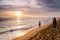 Sundown in Hikkaduwa Beach, with a lady in red