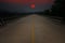 Sundown over long concrete bridge