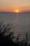 Sundown sky and sea with ship on horizon, bermudas