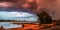 Sundown storm over the riverside of the river Rhein in Cologne with sky and sunlight reflections and bridge in summer