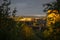 Sundown through trees above village