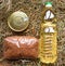 Sunflower, canned meat oil and buckwheat on dry hay straw background.