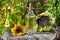 Sunflower oil in a glass Bottle and sunflowers outdoor