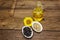 Sunflower oil in glass cruet with flower head and seeds in wooden bowl