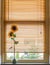 Sunflowers in ceramic vase at the window, summer decoration