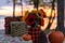 Sunflowers and pumpkins on a picnic table by the lake