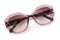 Sunglasses in antique pink bright color in transparent plastic. Eyewear top view with shadow. Trendy glasses isolated on white