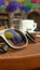 Sunglasses on the coffee table with reflection to umbrellas