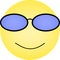 Sunglasses emoticon with happy smile on face