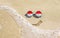 Sunglasses with flag of Indonesia on a sandy beach. Nearby is a sea lightning and a painted smile.