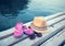 Sunglasses, flip-flops and hat on the wooden texture in summer