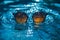 sunglasses float in the water in warm sunny weather