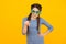 Sunglasses are health necessity. dissatisfied kid yellow background. get party started. kid pointing finger. Portrait of