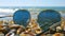 Sunglasses left on the seashells beach, focus on the seashells.