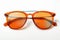 Sunglasses with orange glass in stylish iron frame isolated white