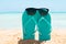 Sunglasses Over The Turquoise Flip Flop