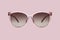 Sunglasses pink plastic transparent frame and brown polarized lenses isolated on background