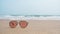 Sunglasses placed on the beach