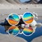 Sunglasses with reflection on the sand. Selective focus.