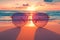 Sunglasses rest on sandy beach, framing vibrant ocean sunset