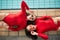 Sunglasses, swimwear and fashion women or friends in red bodysuit at indoor swimming pool. Portrait above young people