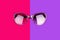 Sunglasses vibrant pink and purple background close up top view, fashionable sunshades colorful backdrop, trendy female eyeglasses