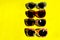 Sunglasses On Yellow Background.