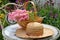 Sunhat and basket of miniature roses