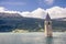 Sunken church tower in lake in the alps