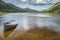 Sunken paddle boat in Lough Gummeenduff with view on beautiful Black Valley